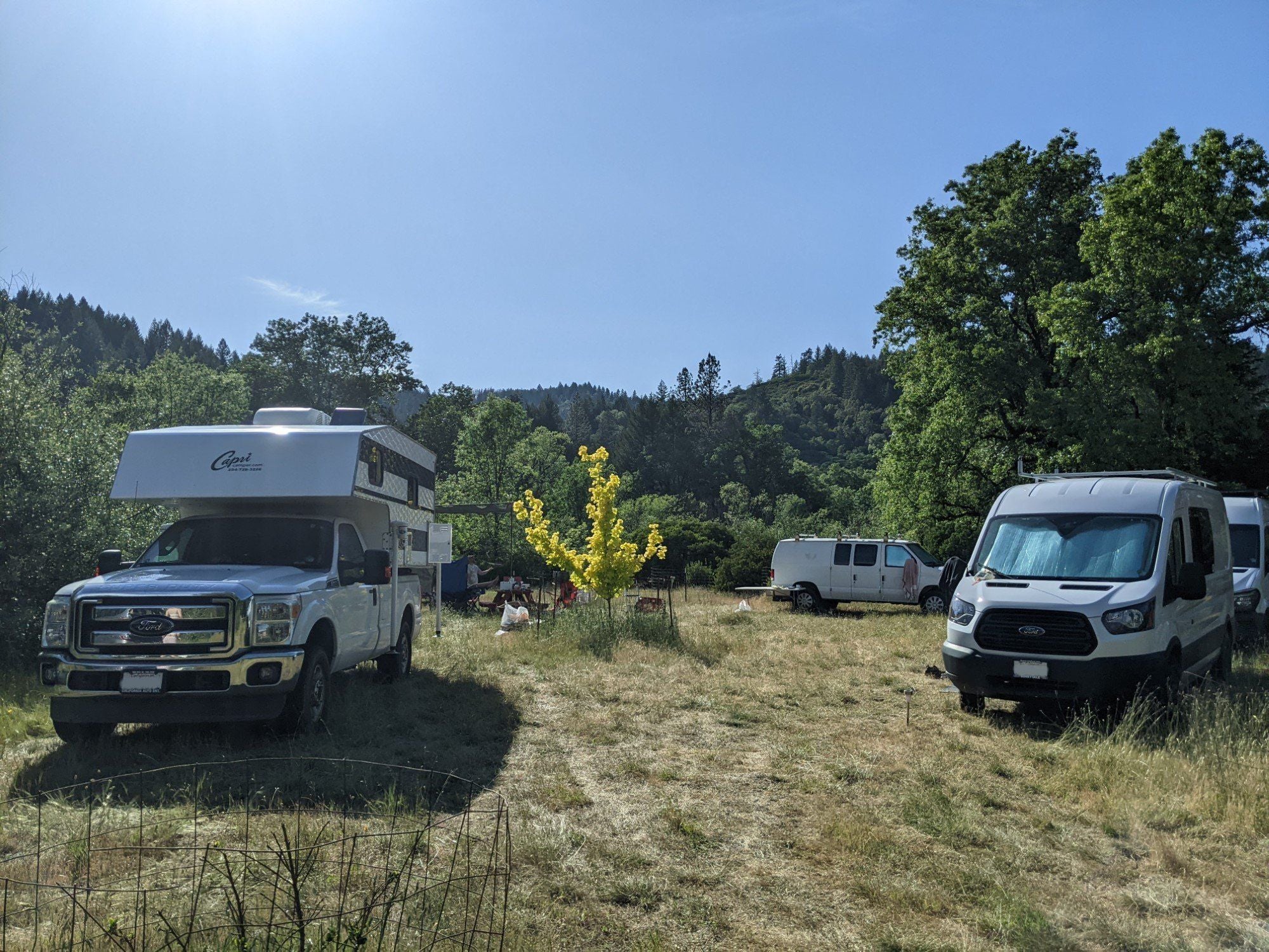 Off-grid RVs using House2Start 12V starter battery charger in scenic location.