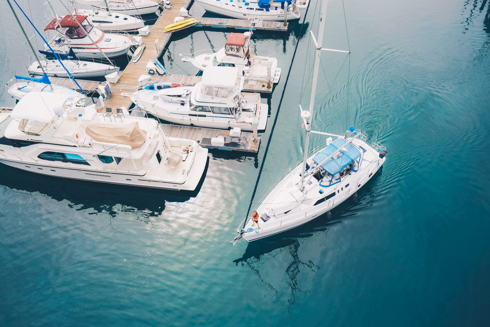 Motor yacht docked in a marina, where House2Start keeps starter batteries charged.