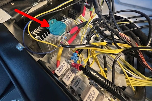Picture of the Mastervolt Chargemate device under the passenger seat in a Winnebago Navion motorhome.